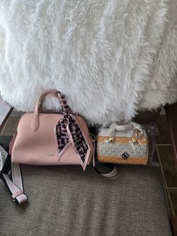 2 hand bags each separate Dkny and Michael kors