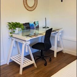 Beautiful desk with glass top to display art, office or school supplies, magazines or books. 59wx28dx30h. Height can be adjusted a bit