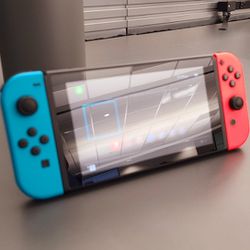 Nintendo Switch + Charger