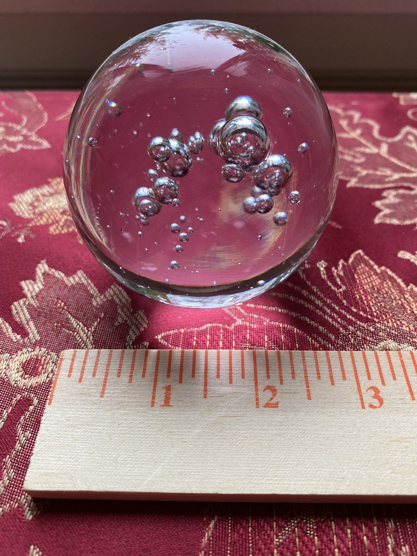 Crystal ball paperweight with bubbles inside
