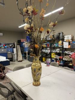 Vase With Very Fall Stems And Flower