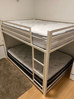 Bunk bed with almost brand new mattresses but top side bar broken