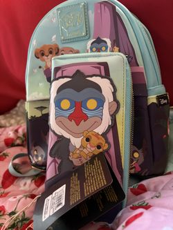 The Loungefly Disney Lion King Pride Rock Backpack And Wallet