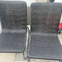 Set of 2 Rattan Chairs 23” W, low profile, Stacking. Indoor or Outdoor all weather