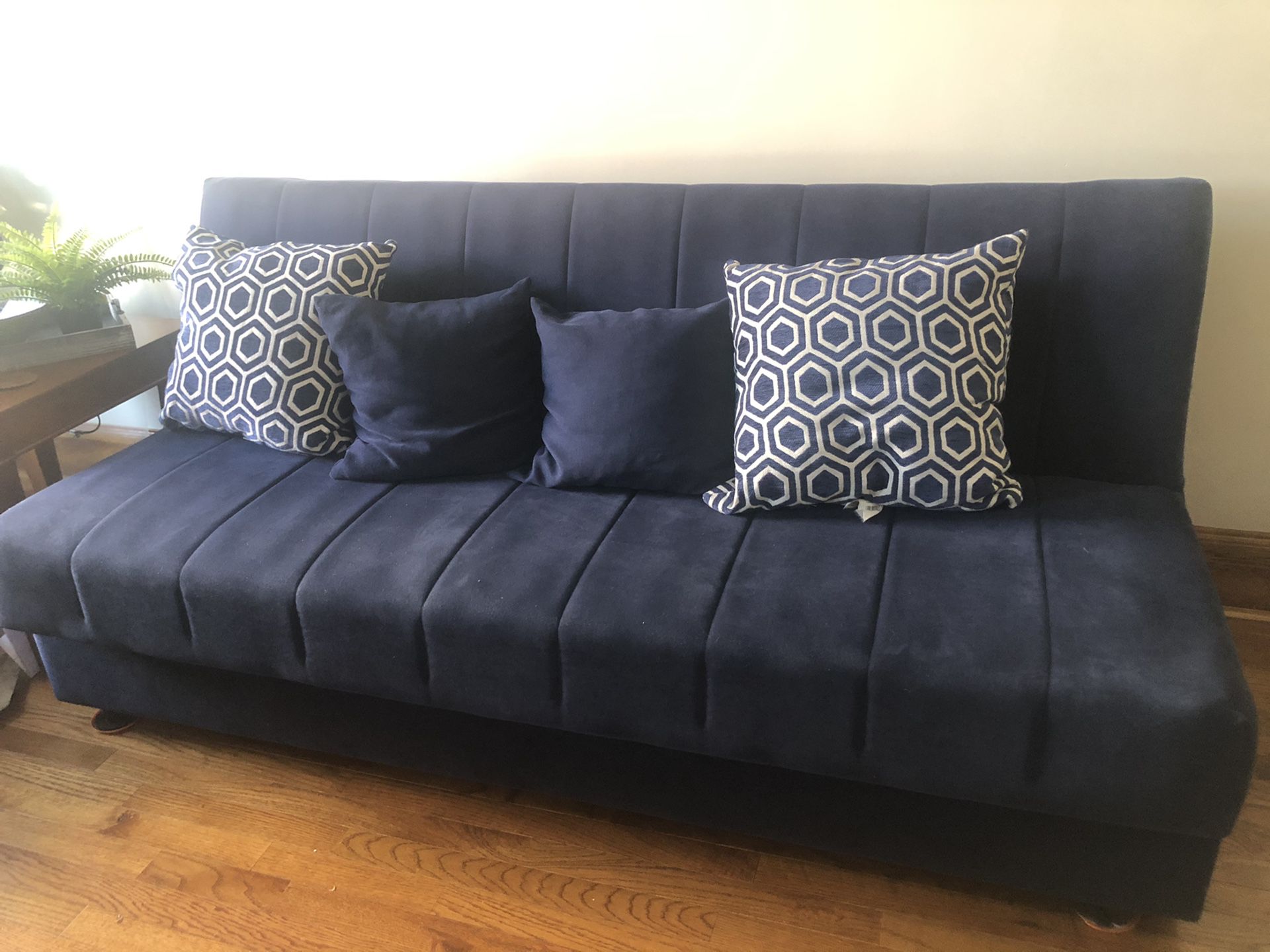 Navy blue Couch folds open into bed
