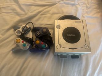 GameCube and two controllers