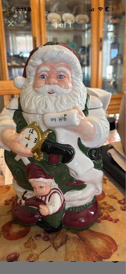 This is a vintage JC Penney ceramic Santa Claus and Elf Checking Gift List large cookie jar.