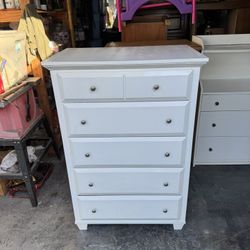 Traditional white wood 5-drawer tall boy dresser .