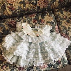 vintage baby dress in a light blue or mint green color