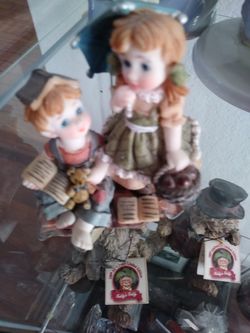 Boy girl figure with books and umbrella