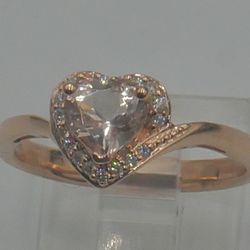 10kt rose gold ring 2.5 gr w 18 small diamonds & pink heart shaped CZ size 7.25. 878899-1. very good condition. 