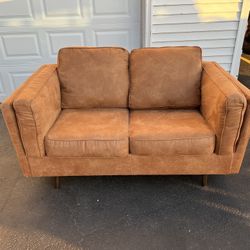 A Modern Couch And Loveseat