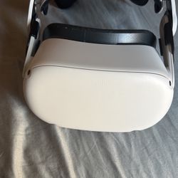 Oculas Quest 2 Headset With Head Band, Remotes, And Charger
