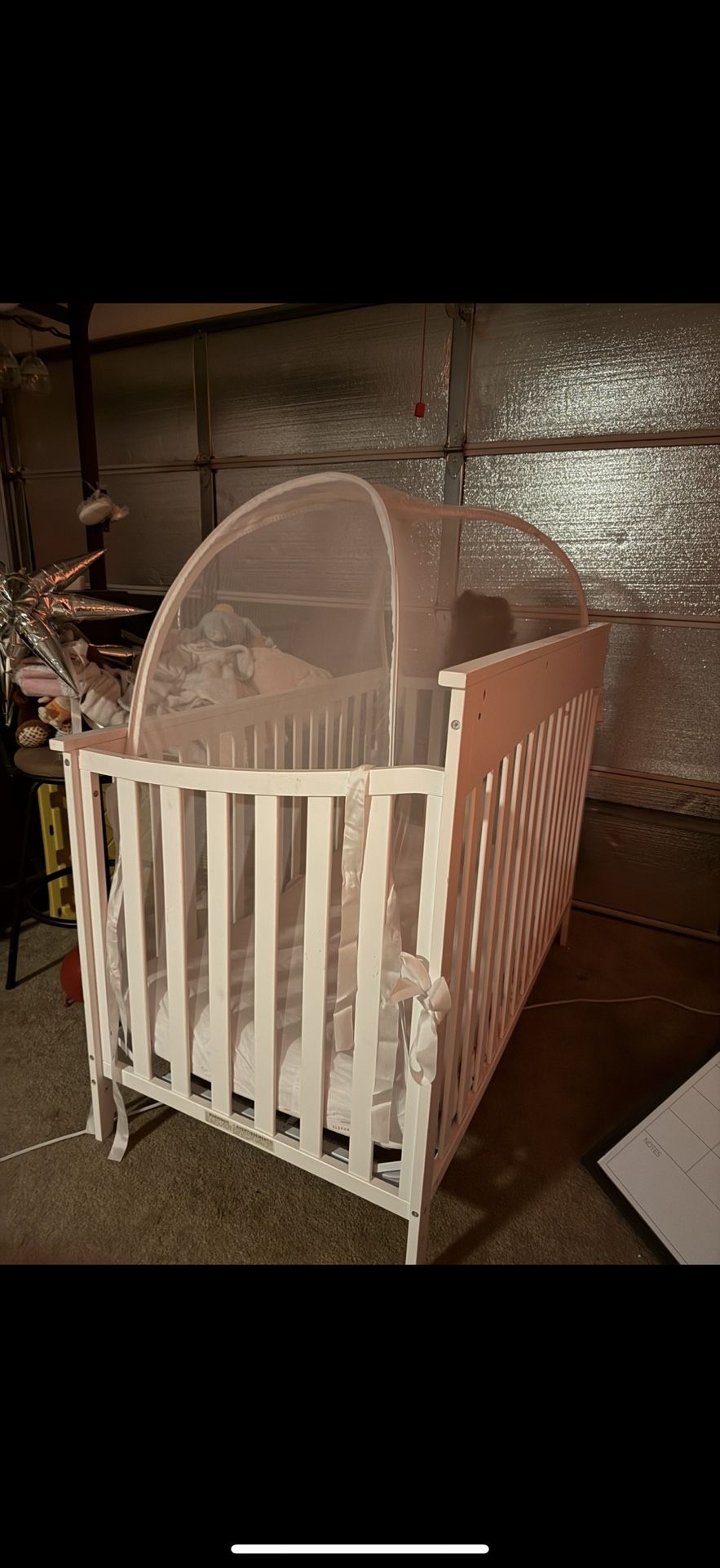 Crib With Toys And Other Baby Items