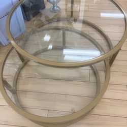 2 overlapping glass coffee tables