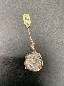 Atocha silver coin pendant in gold bezel