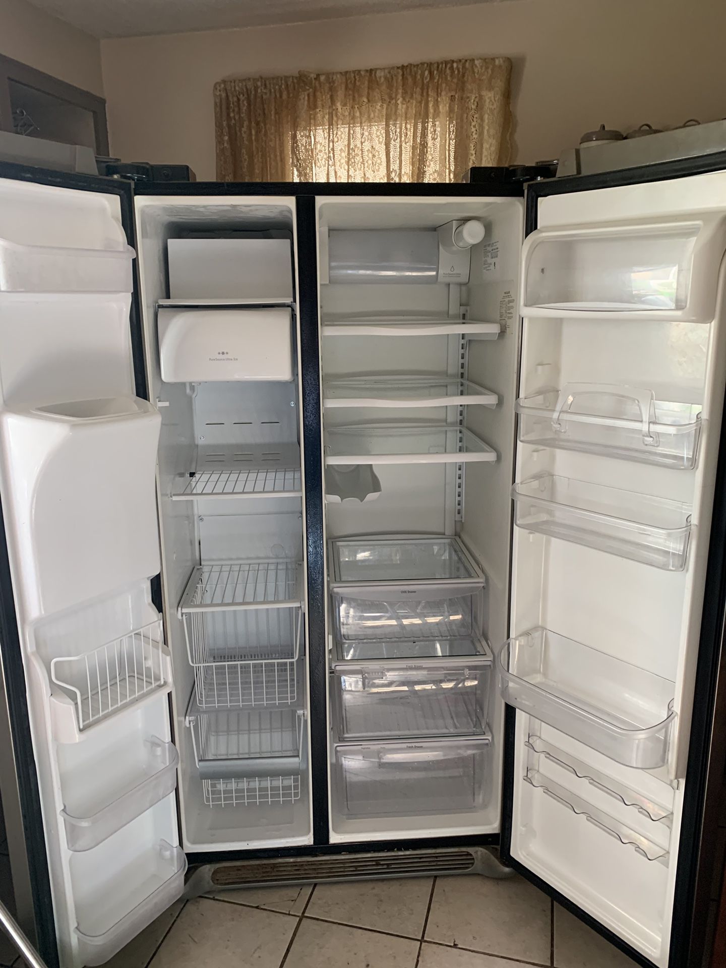Frigidaire side by side refrigerator with ice maker