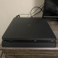 PS4 With 2 controllers, Headset and 4 Games.