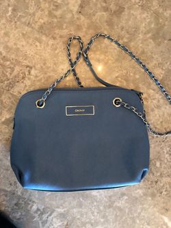 Donna Karan perfect size ..Strap is cross body or doubles up as handle