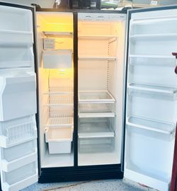 Kenmore Side-by-Side refrigerator with water and ice dispenser in the door. In excellent working con