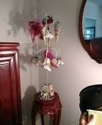 Handcrafted mix of love related items on a metal tree
