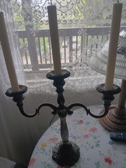 Two silver candelabras