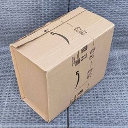 Clean medium size cardboard box with foam packing peanuts for shipping moving or storage