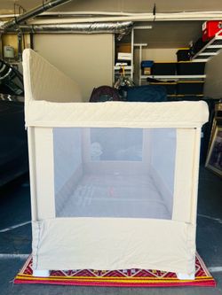 Collapsible travel crib, comes with cover, and organic mattress.