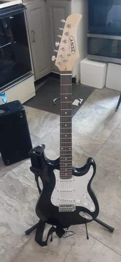 GUITAR WITH STRAP AND STAND CLICK ON PICTURE YOU WILL GET FULL PICTURE YOU 