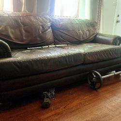 Brown genuine leather sofa with footrest
