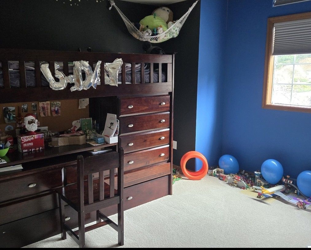 Loft bed with desk, dresser, storage/closet and trendle (2nd) bed.