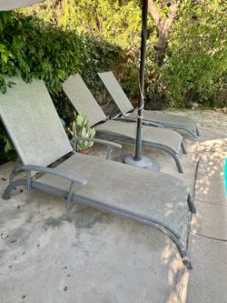 Three reclining deck chairs