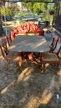 Mid century table with Victorian chairs