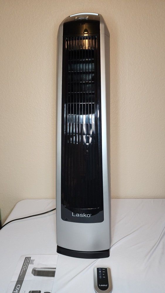 Lasko High Velocity Oscillating Tower Fan for Bedroom, Garage, Basement, and Gym with Remote Control, Timer, 3 Powerful Speeds, 35" Silver/Black