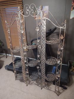 One of a kind vintage wrought iron plant stand.