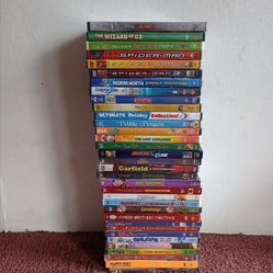 Tall stack of assorted children's DVD movies.