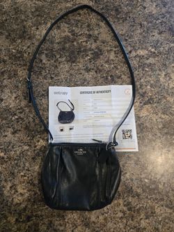 Black Coach crossbody purse with silver hardware and COA