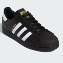 Adidas Superstar Sneakers – Black/White (Classic Style) Authentic Adidas Superstar sneakers in black with white stripes and a white heel tab. Timeless