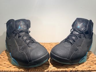 Men’s Jordan True Flight sneakers in the black and royal-blue colorway.
