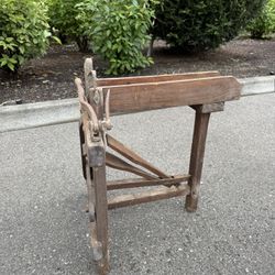 Antique wooden press or woodworking machine.