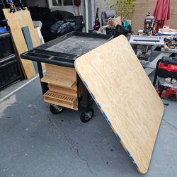 Mobile cart workstation, removable table top, inflated tires, french cleat for tools, power strip.  Paper towel holder, no tools included