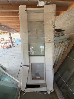 31 x 82 Exterior door with doggy door on the bottom