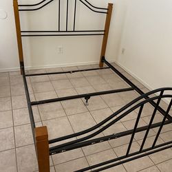 Queen Size Headboard And Foot Board. Wood And Black Metal Frame. Great Condition. Goes With Any Decor. $45.00