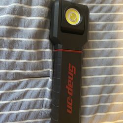 Snap on hand held rechargeable light