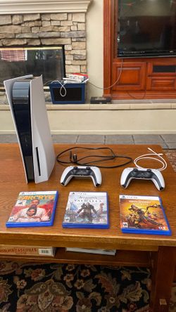 PlayStation 5 + Two DualSense Controllers + Three Disc Games