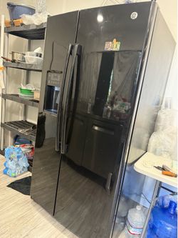 Black used fridge with icemaker