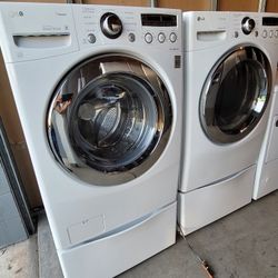 LG Front Load Washer And Stackable Gas Dryer Set With Pedestals 