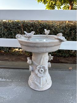 White clay bird bath