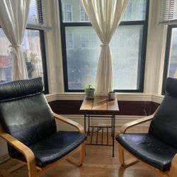 A Pair Of Black Leather Recliner Arm Chairs