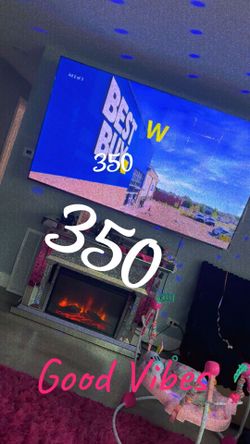85 inch TV and fire place